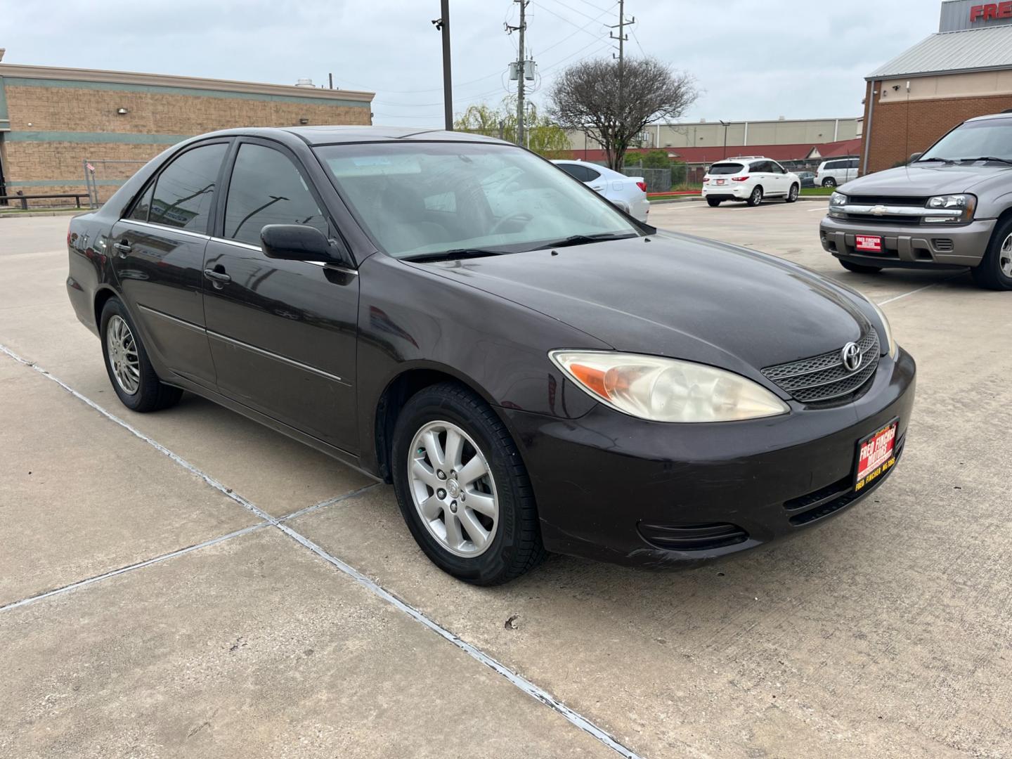 2002 BROWN /tan Toyota Camry LE V6 (JTDBF32K420) with an 3.0L V6 DOHC 24V engine, 4-Speed Automatic Overdrive transmission, located at 14700 Tomball Parkway 249, Houston, TX, 77086, (281) 444-2200, 29.928619, -95.504074 - Photo#0